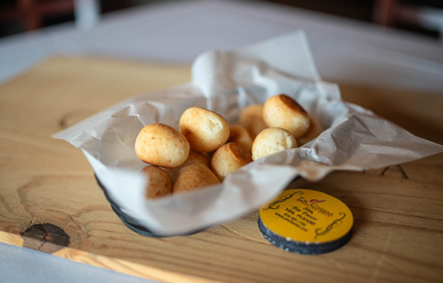 Pão de queijo, a traditional Brazilian cheese bread, made primarily with tapioca flour, cheese, milk, oil, and eggs.