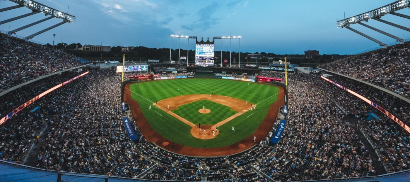 Kansas City Royals ballpark, Kauffman Stadium, packed full of baseball fans for a night game.